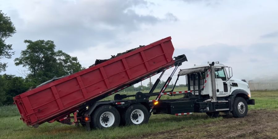 20 cu yard roll off dumpster being dropped off for junk removal in Des Moines Iowa