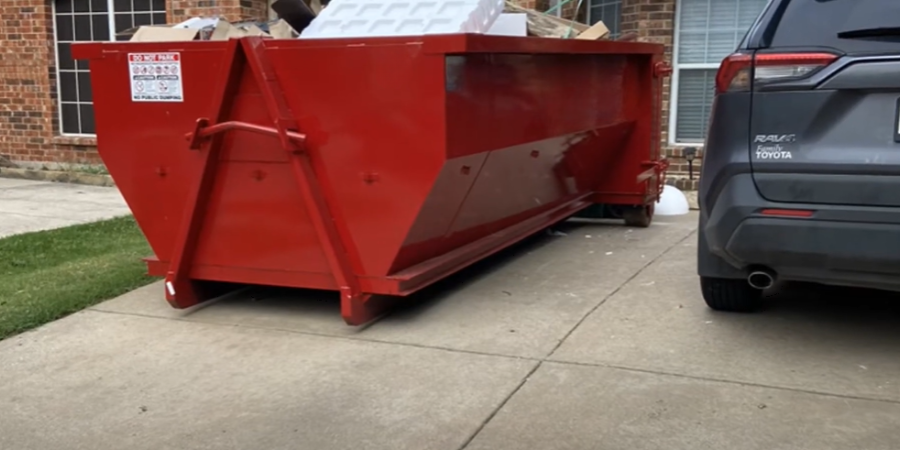 a roll off dumpster rental in a home driveway